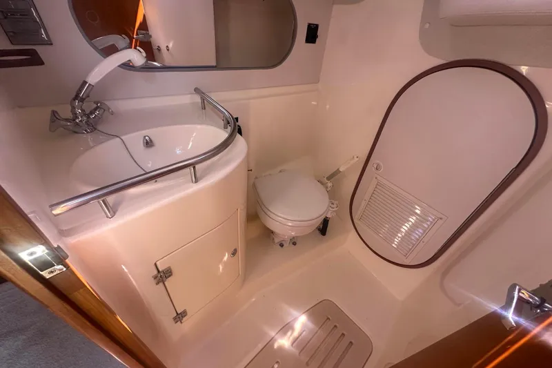 Slide: The Image of Fully Enclosed Head With  Sink and Toilet. - 57