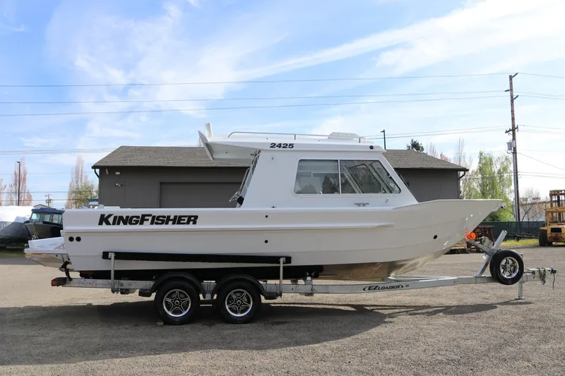 The Image of 2026 KingFisher 2425 Escape HT boat on trailer, parked outdoors. - 1