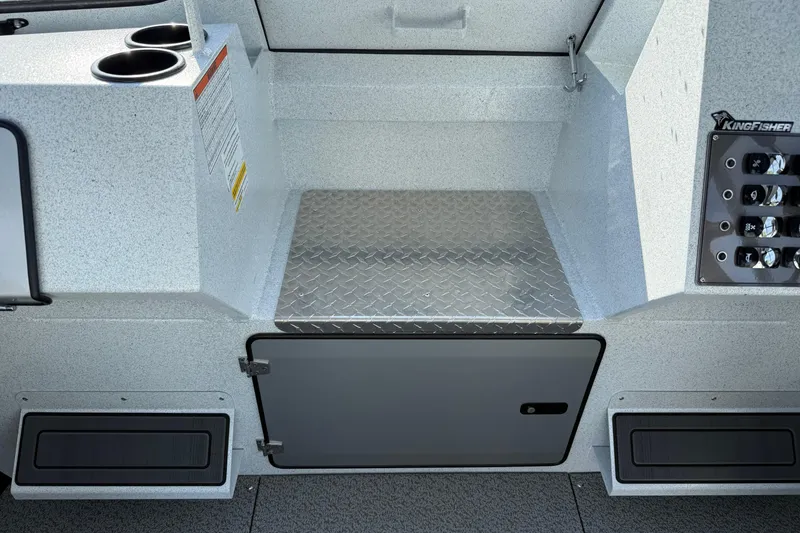 Slide: The Image of Interior of 2026 KingFisher 2425 Escape HT boat with storage and control panel. - 18
