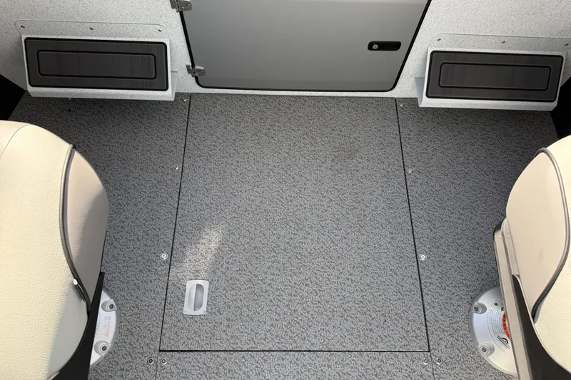 Slide: The Image of Interior view of 2026 KingFisher 2425 Escape HT boat, featuring seating and storage compartments. - 19