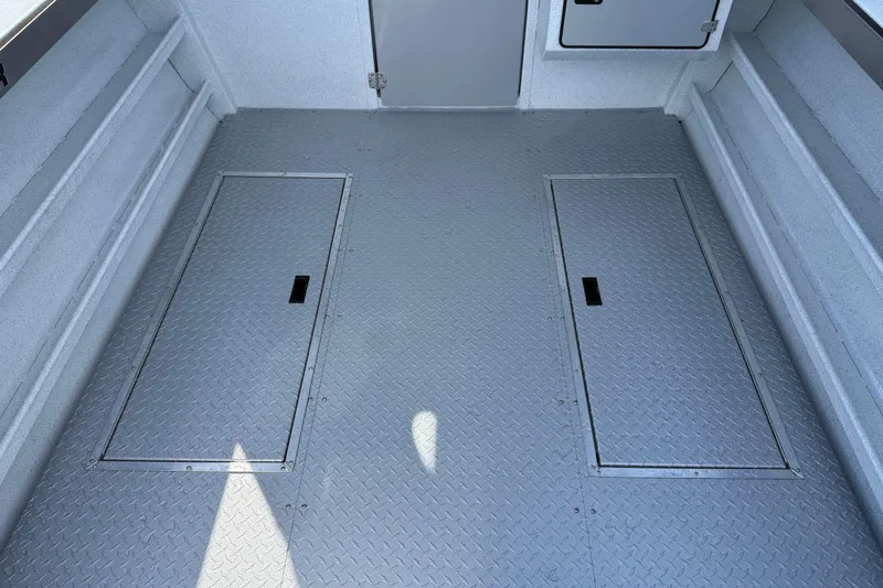 Slide: The Image of Interior of 2026 KingFisher 2425 Escape HT boat with diamond plate flooring. - 21