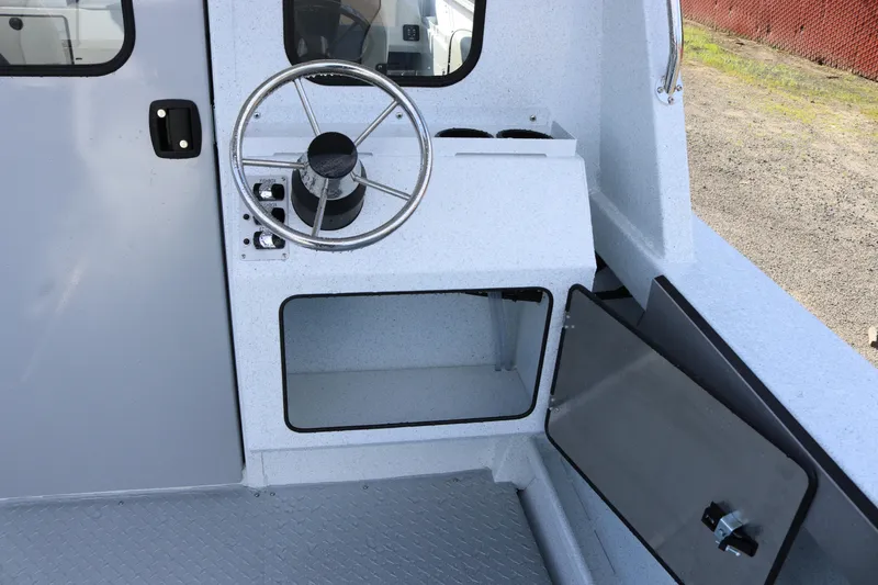 Slide: The Image of Interior view of 2026 KingFisher 2425 Escape HT boat helm station. - 28