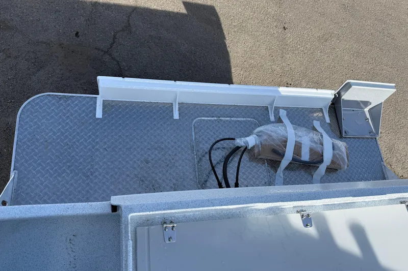 Slide: The Image of Diamond plate deck of 2026 KingFisher 2425 Escape HT boat with wrapped equipment. - 34