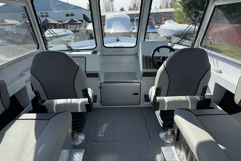 Slide: The Image of Interior of 2026 KingFisher 2425 Escape HT boat with dual seats and steering console. - 6