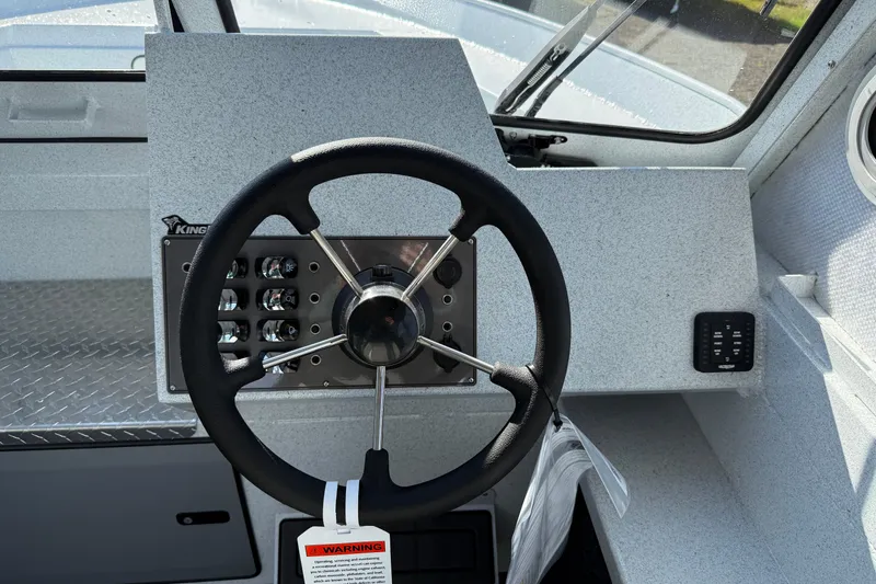 Slide: The Image of Steering wheel and dashboard of 2026 KingFisher 2425 Escape HT boat. - 9