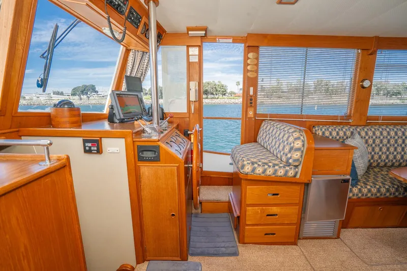 Slide: The Image of Interior of 1987 Grand Banks 46 Classic yacht with wood finish and seating area. - 22