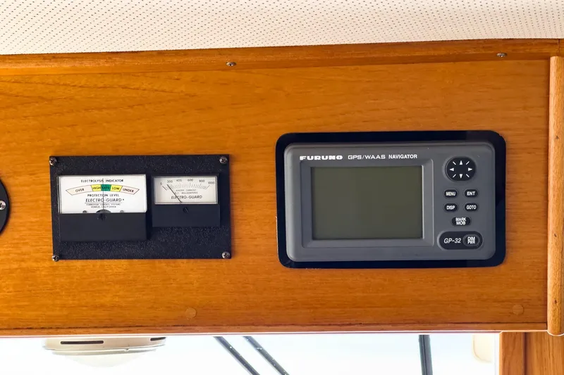 Slide: The Image of Electronics panel on 1987 Grand Banks 46 Classic, featuring Furuno GPS navigator. - 29