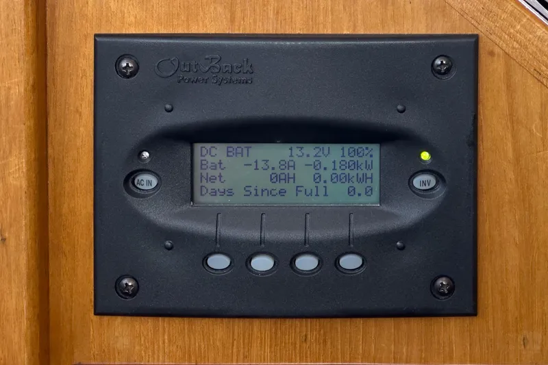 Slide: The Image of OutBack Power Systems display on 1987 Grand Banks 46 Classic, showing battery status and power usage. - 33
