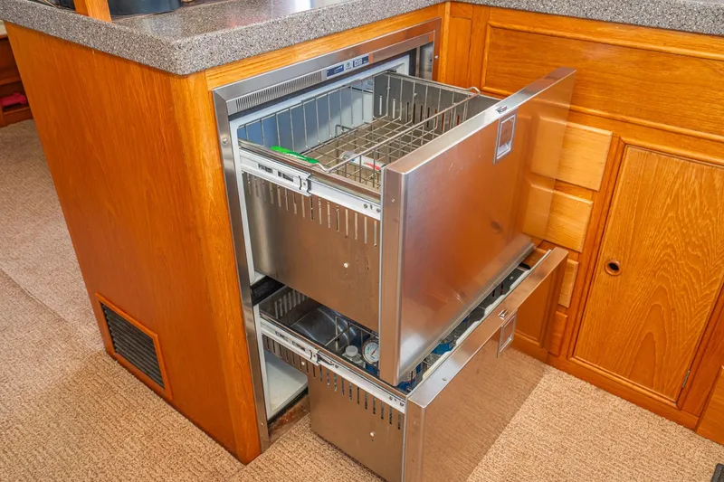 Slide: The Image of Stainless steel refrigerator drawers in 1987 Grand Banks 46 Classic yacht kitchen. - 43