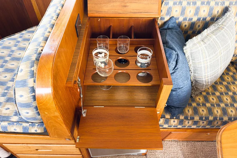 Slide: The Image of Interior of 1987 Grand Banks 46 Classic yacht with wooden bar and glassware. - 48