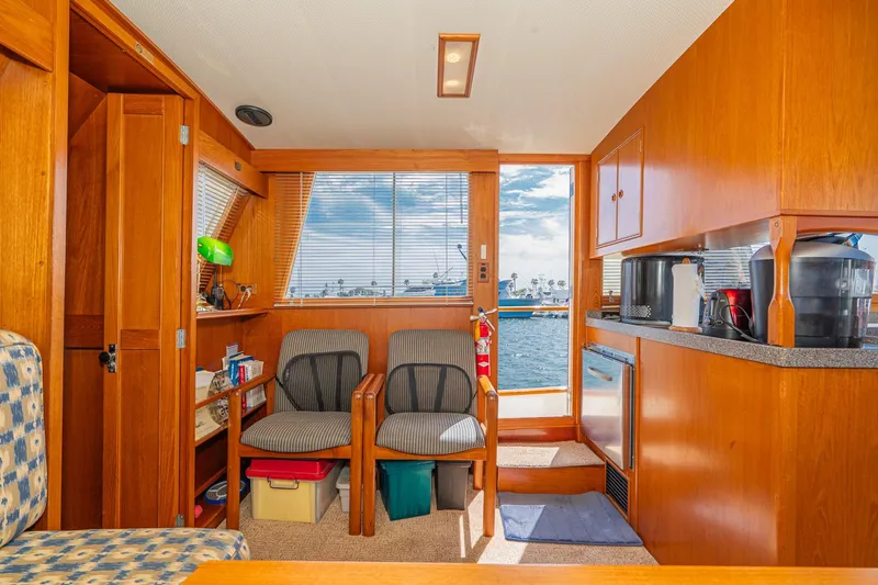 Slide: The Image of Interior of 1987 Grand Banks 46 Classic yacht with wooden furnishings and ocean view. - 51