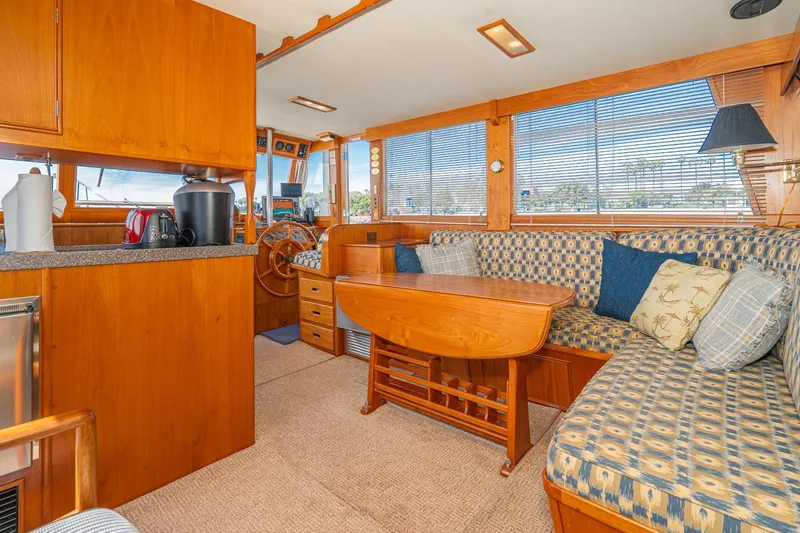Slide: The Image of Interior of 1987 Grand Banks 46 Classic yacht with cozy seating and wooden finishes. - 54