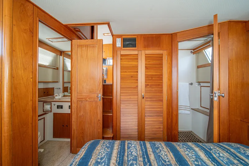 Slide: The Image of Interior of 1987 Grand Banks 46 Classic yacht with wooden cabinetry and cozy bedroom. - 63