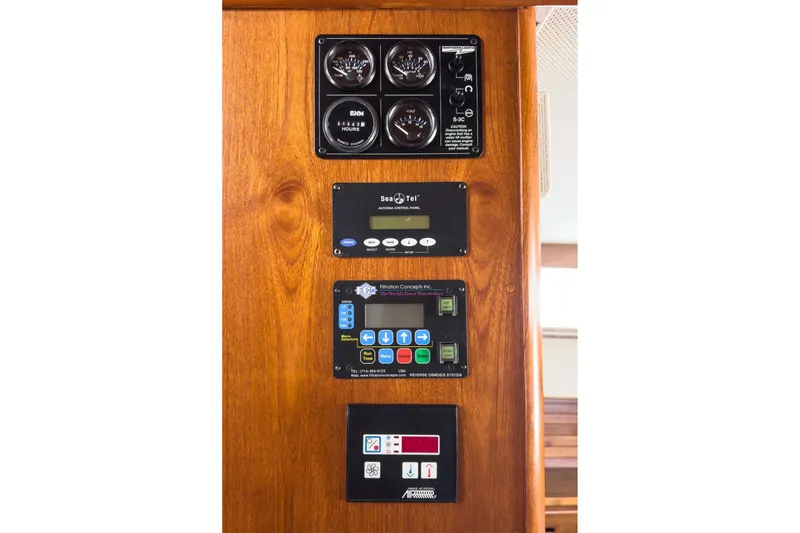 Slide: The Image of Control panel on 1987 Grand Banks 46 Classic yacht, featuring gauges and electronic systems. - 76