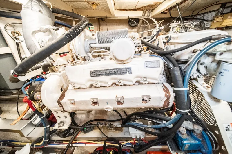 Slide: The Image of Engine room of a 1987 Grand Banks 46 Classic with a Caterpillar engine. - 84
