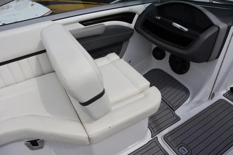 Slide: The Image of Interior of 2012 Cobalt A25 boat with white seating and modern dashboard design. - 12