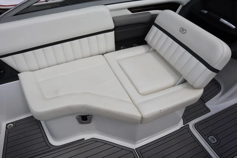 Slide: The Image of White leather seating on 2012 Cobalt A25 boat, featuring sleek design and comfortable cushions. - 13