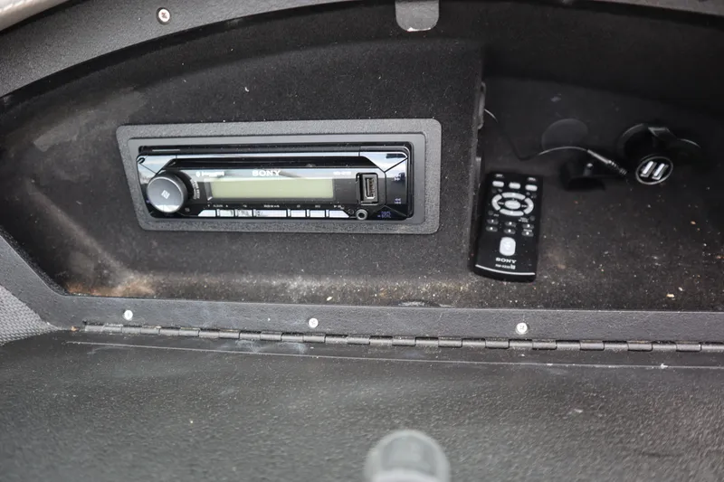 Slide: The Image of Sony stereo system with remote in a 2012 Cobalt A25 boat compartment. - 15