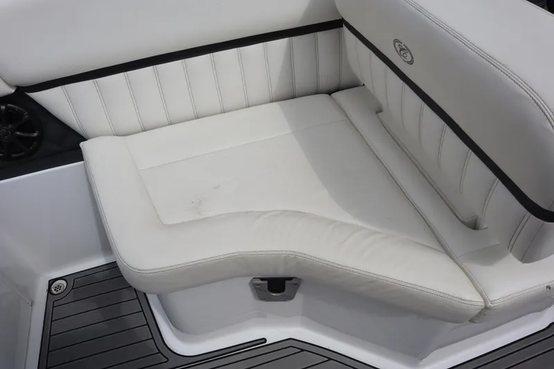 Slide: The Image of White leather seating on a 2012 Cobalt A25 boat, featuring sleek design and comfort. - 18