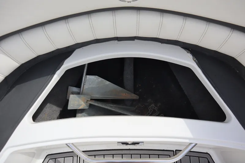 Slide: The Image of Anchor storage compartment on a 2012 Cobalt A25 boat. - 6