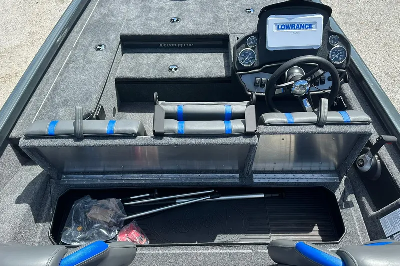 Slide: The Image of 2026 Ranger RT178 boat interior with steering wheel, seats, and storage compartments. - 13