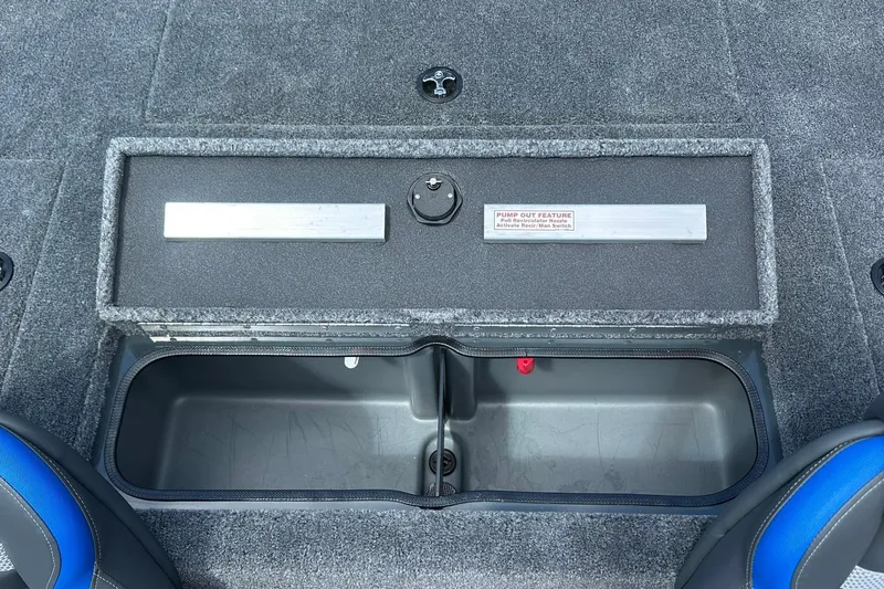 Slide: The Image of 2026 Ranger RT178 boat storage compartment with pump-out feature, open lid, and gray interior. - 16