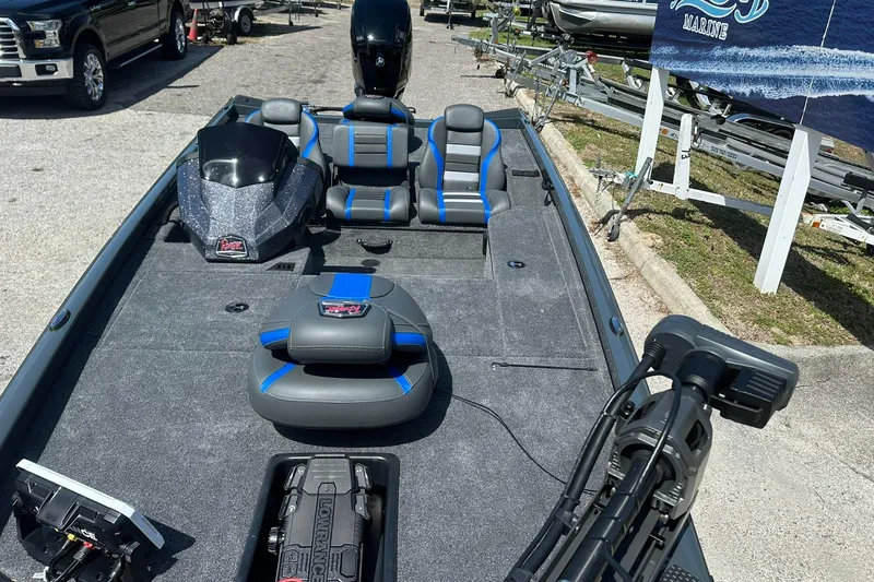 Slide: The Image of 2026 Ranger RT178 boat with blue accents, featuring seating and navigation equipment. - 3