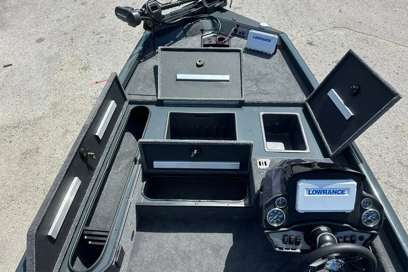 Slide: The Image of 2026 Ranger RT178 boat interior with Lowrance electronics and storage compartments. - 7