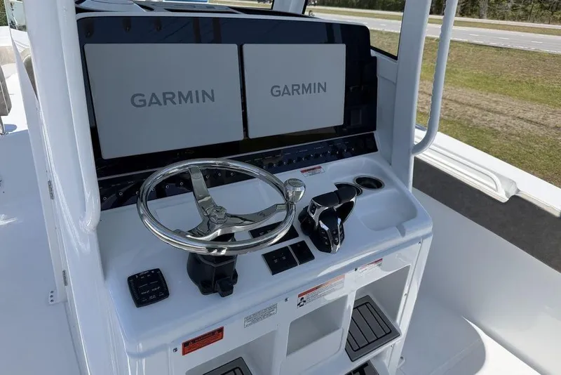 Slide: The Image of 2026 Sea Hunt Gamefish 30 helm with dual Garmin displays and steering wheel. - 15