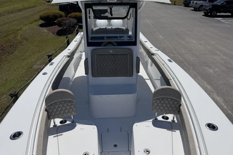 Slide: The Image of 2026 Sea Hunt Gamefish 30 Forward Seating boat on trailer, parked outdoors. - 5