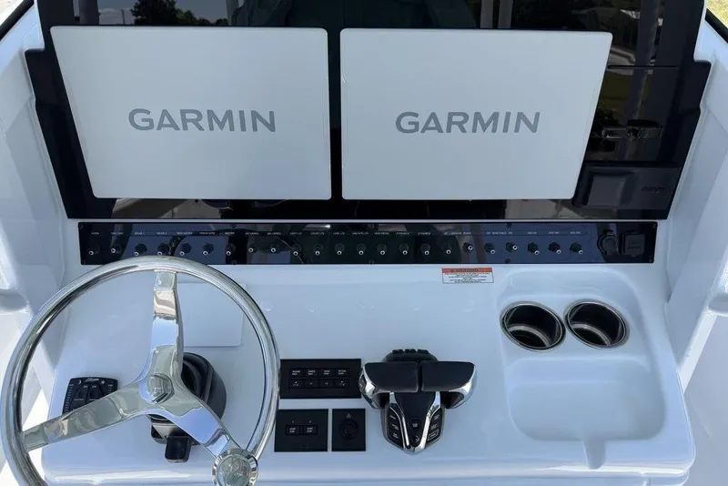Slide: The Image of 2026 Sea Hunt Gamefish 30 Forward Seating boat interior with cushioned seats and storage. - 6