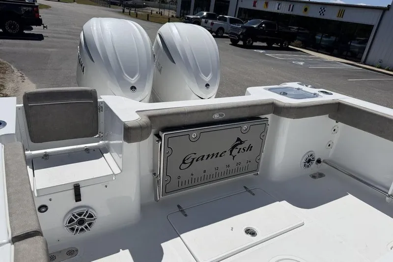 Slide: The Image of 2026 Sea Hunt Gamefish 30 boat on trailer at marine service center. - 7