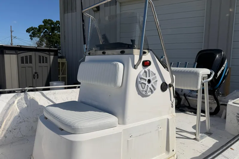 Slide: The Image of 2004 Kenner 1800 VISION boat with seating and Mercury outboard motor. - 16