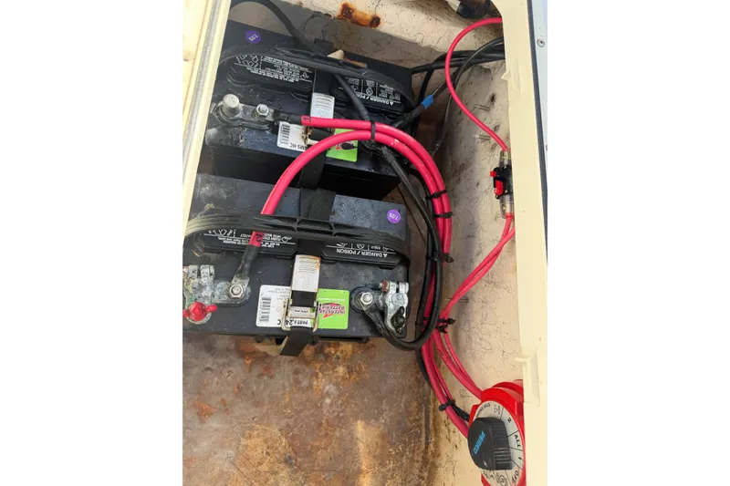 Slide: The Image of Battery compartment of a 2004 Kenner 1800 VISION boat with wiring and connections. - 20