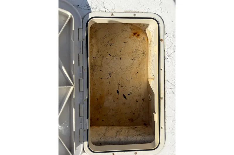 Slide: The Image of Open storage compartment on a 2004 Kenner 1800 VISION boat, showing interior details. - 21
