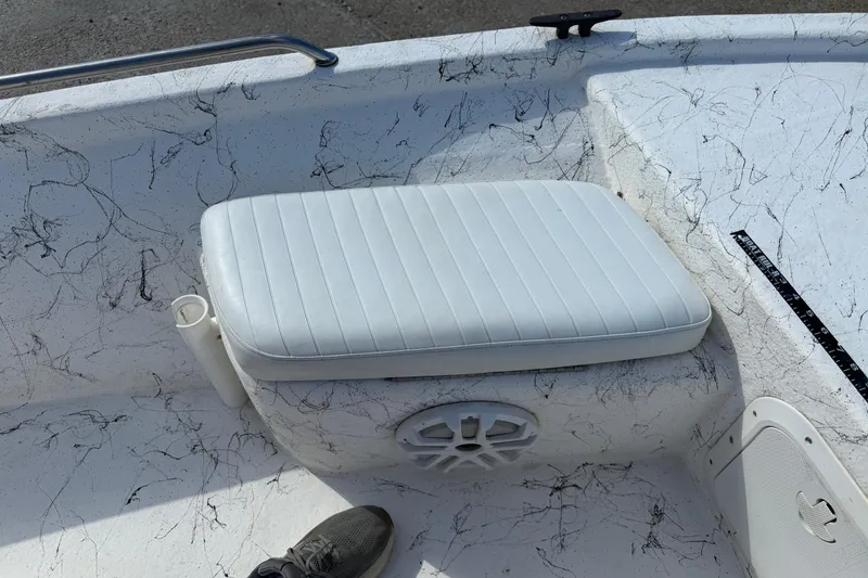 Slide: The Image of White cushioned seat on 2004 Kenner 1800 VISION boat with marbled deck design. - 23
