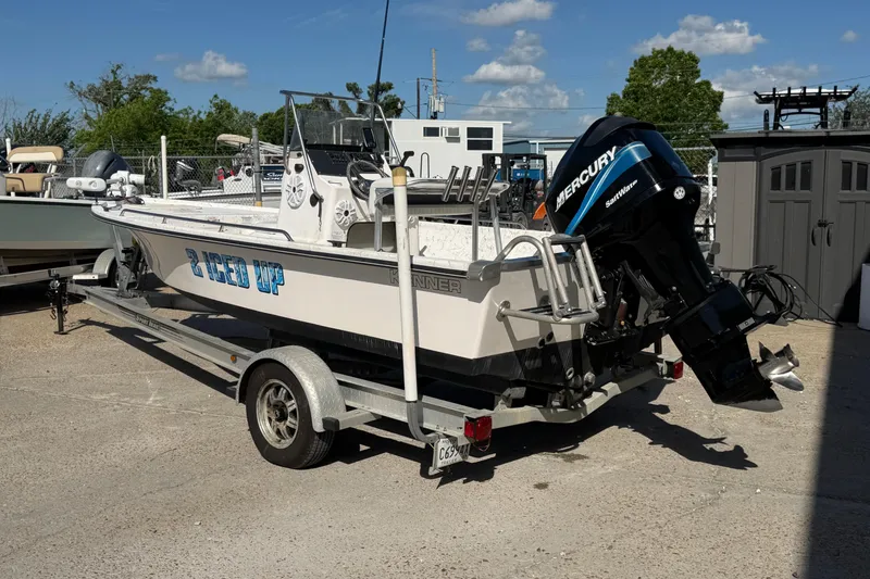 Slide: The Image of 2004 Kenner 1800 VISION boat on trailer with Mercury outboard motor. - 4