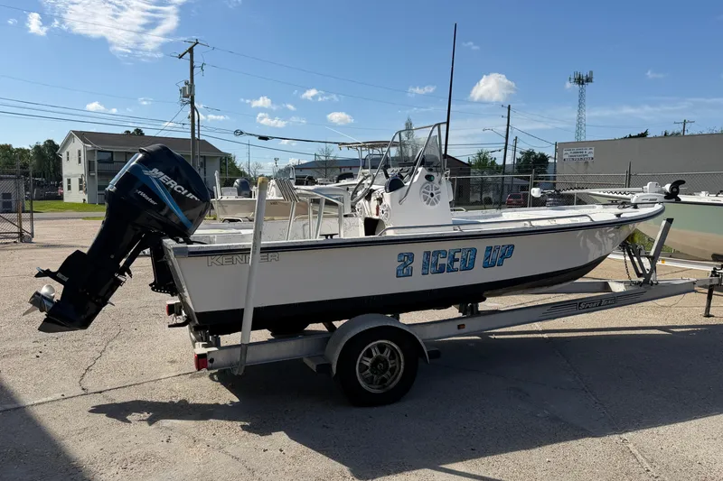 Slide: The Image of Kenner 1800 VISION 2004 boat on trailer with Mercury outboard motor. - 7