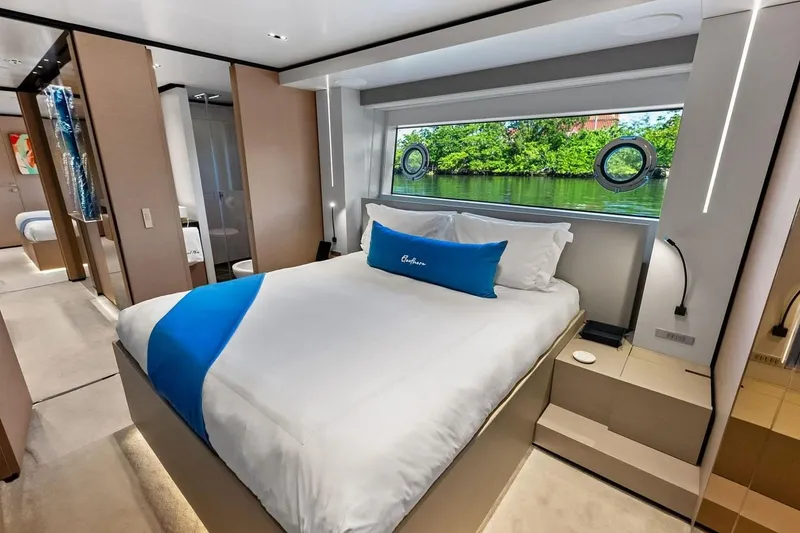 Slide: The Image of Luxurious bedroom interior on 2022 Custom Line Navetta 33 yacht with scenic window view. - 86
