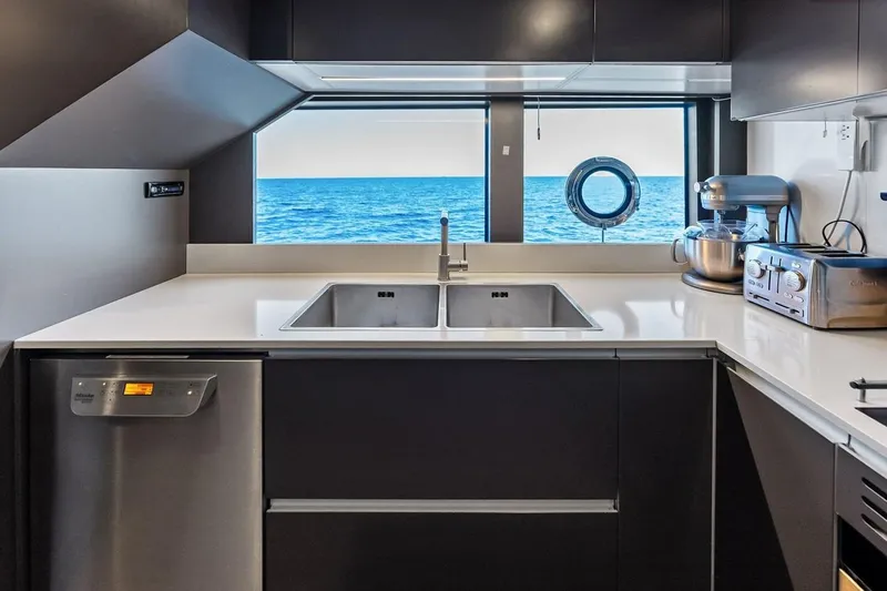 Slide: The Image of Modern kitchen interior on 2022 Custom Line Navetta 33 yacht with ocean view. - 68