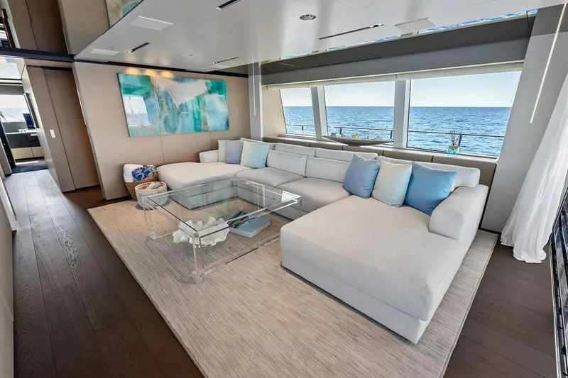 Slide: The Image of Luxurious 2022 Custom Line Navetta 33 yacht interior with ocean view, modern decor, and plush seating. - 44