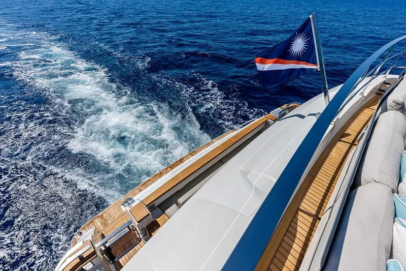 Slide: The Image of Luxurious 2022 Custom Line Navetta 33 yacht cruising on open blue sea. - 33