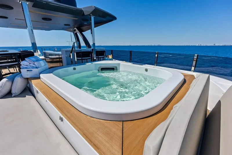 Slide: The Image of Luxurious hot tub on Custom Line Navetta 33 yacht, 2022, with ocean view. - 16