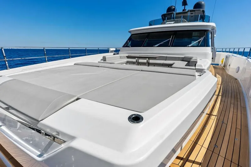 Slide: The Image of Luxurious 2022 Custom Line Navetta 33 yacht deck with sunbathing area, ocean view. - 37