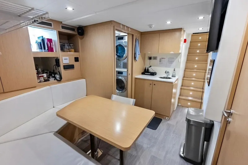Slide: The Image of Luxurious interior of 2022 Custom Line Navetta 33 yacht with modern kitchen and dining area. - 93