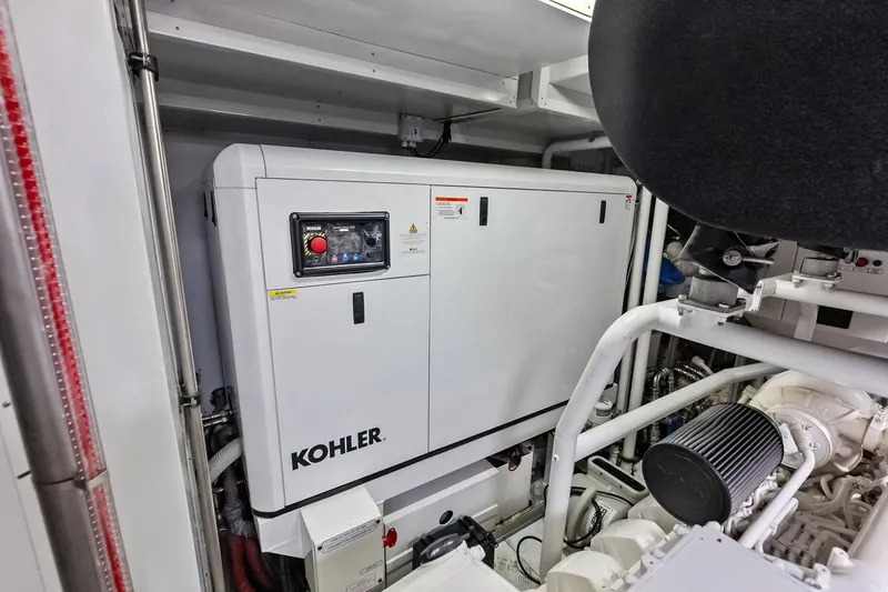 Slide: The Image of Engine room of 2022 Custom Line Navetta 33 yacht featuring Kohler generator. - 107
