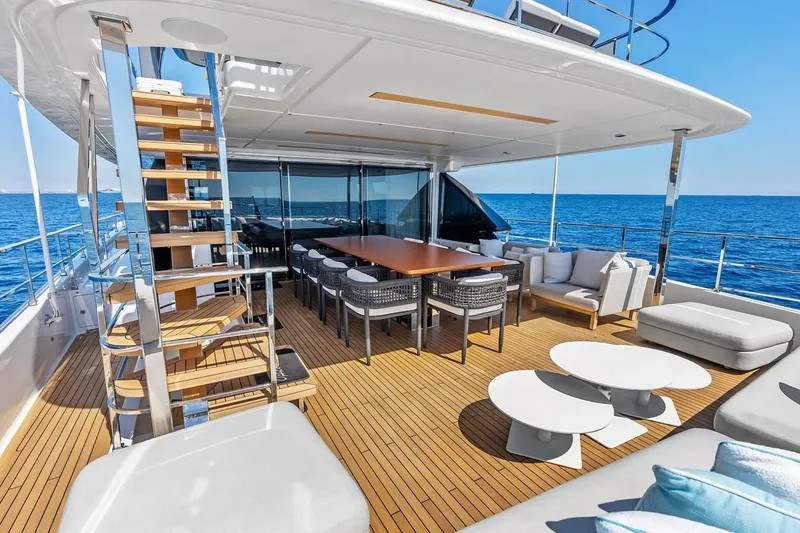 Slide: The Image of Luxurious 2022 Custom Line Navetta 33 yacht deck with elegant seating and ocean view. - 27