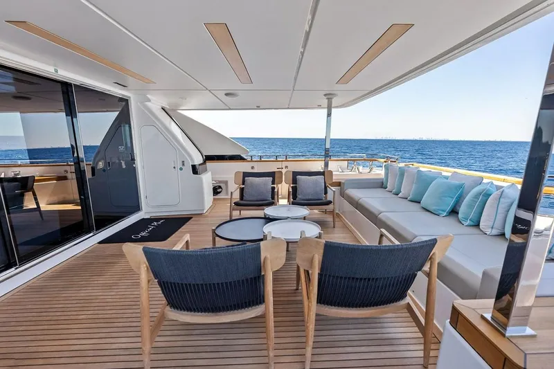 Slide: The Image of Luxurious 2022 Custom Line Navetta 33 yacht deck with elegant seating and ocean view. - 59
