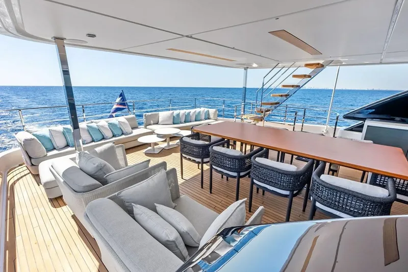 Slide: The Image of Luxurious 2022 Custom Line Navetta 33 yacht deck with elegant seating and ocean view. - 29