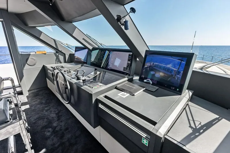 Slide: The Image of Modern helm station of 2022 Custom Line Navetta 33 yacht with advanced navigation systems. - 52